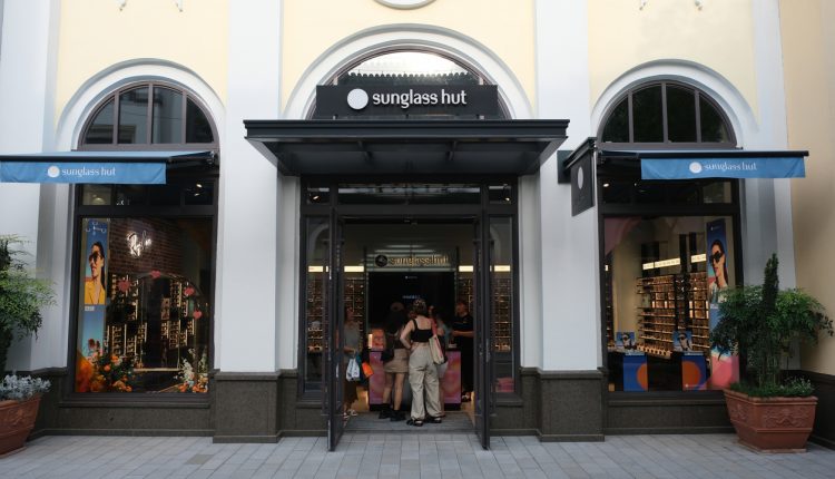 Suzhou,China-August 20th 2023: large Sunglass Hut retail store with customer