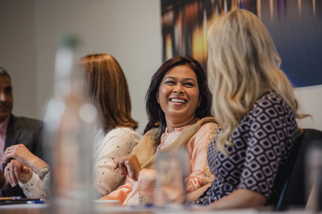 Businesswomen talking before a meeting