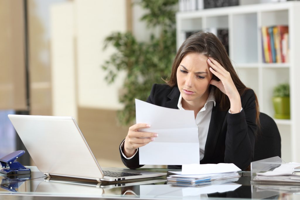 Businesswoman receiving a subpoena