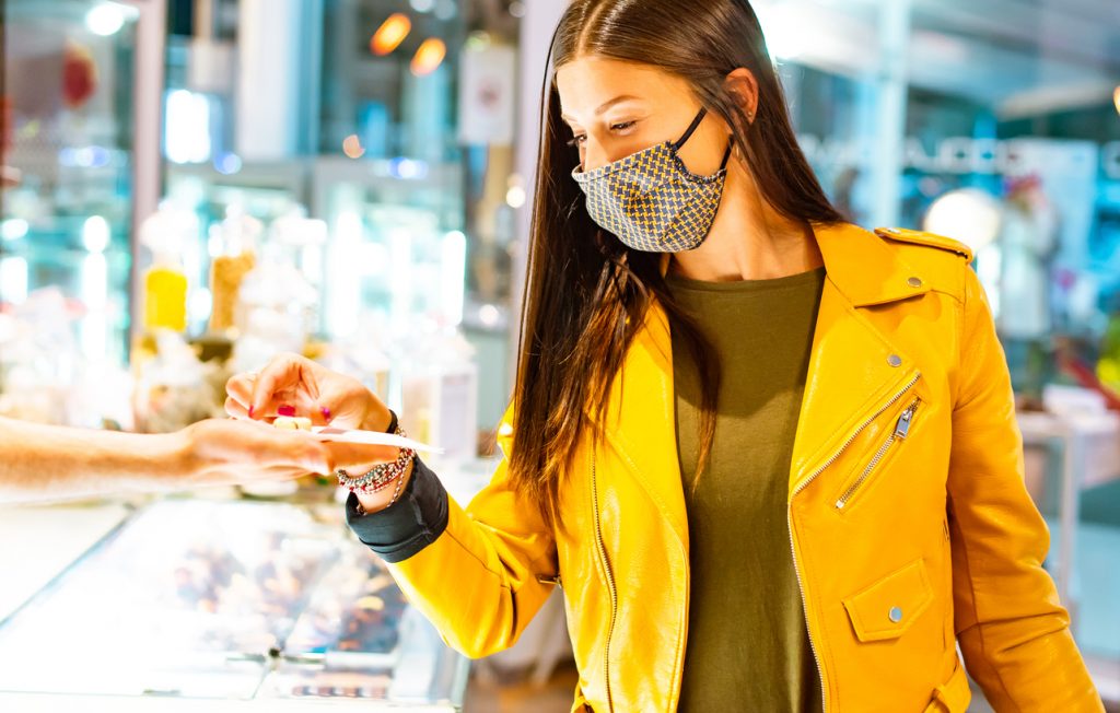 Gen Z shopper in mask enjoying meaningful brand experience