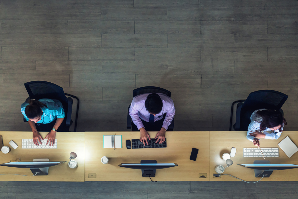Bird's-eye view of office workers at desks