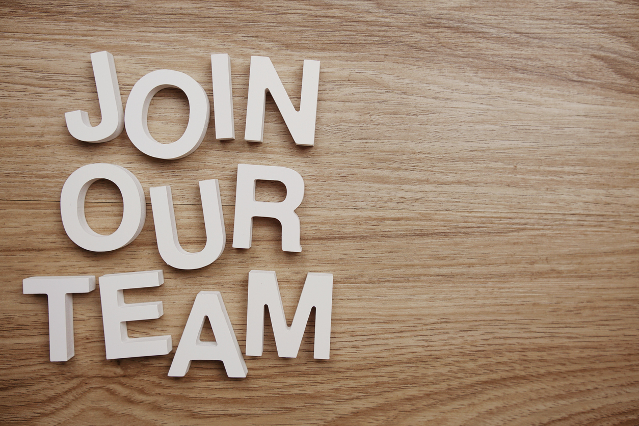 Join Our Team alphabet letters on wooden background