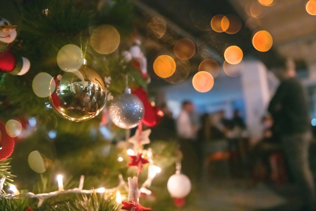 new year and christmas office party close up details food preparing and eating drinks and gifts authentic local startup business team