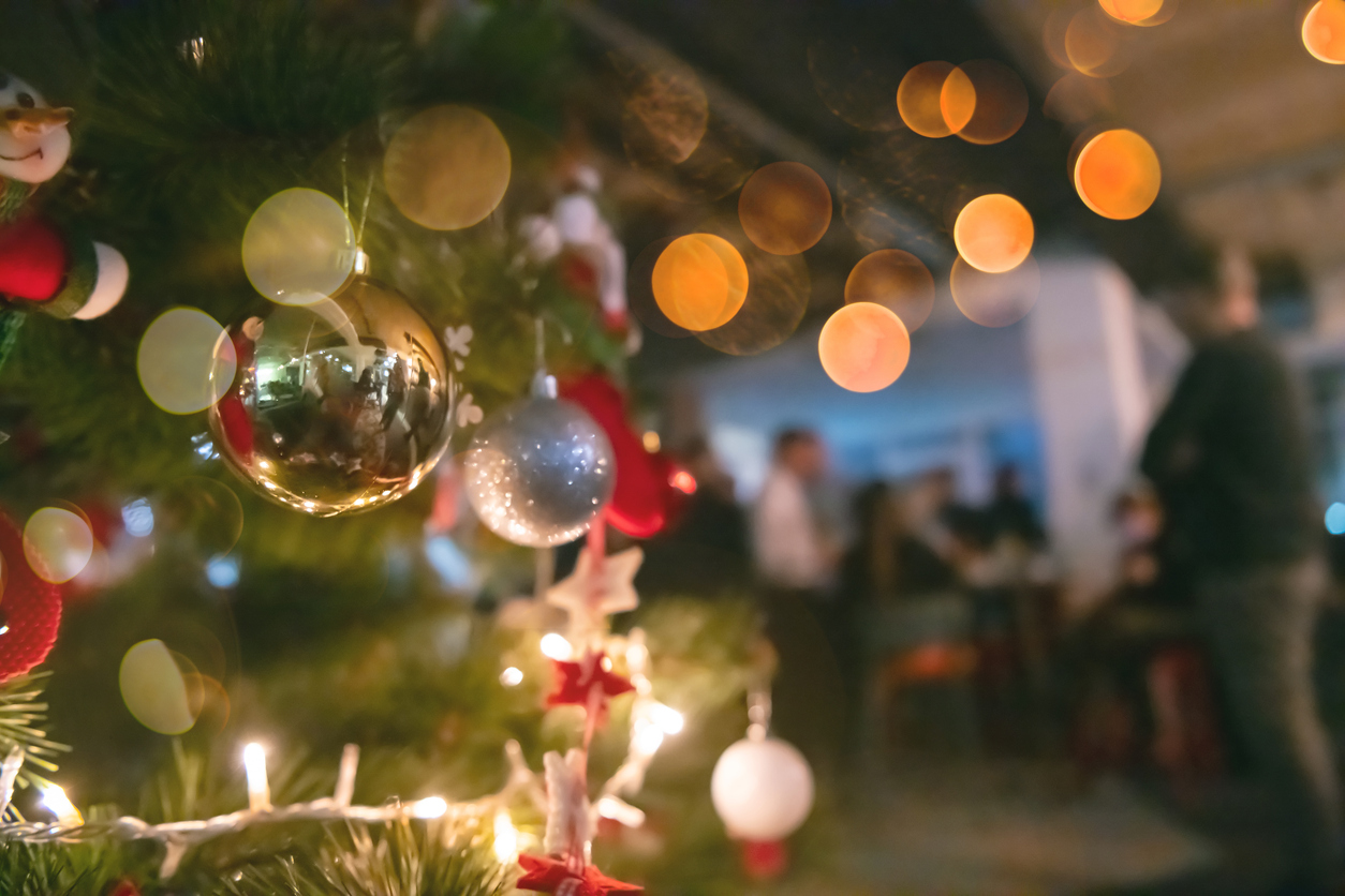 new year and christmas office party close up details food preparing and eating drinks and gifts authentic local startup business team