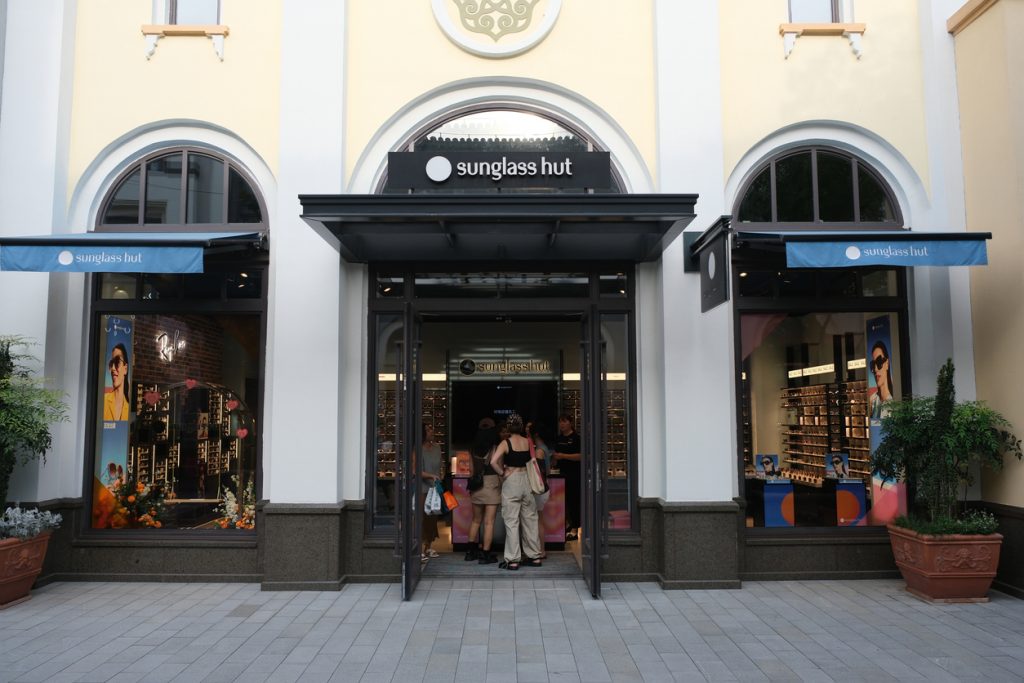 Suzhou,China-August 20th 2023: large Sunglass Hut retail store with customer