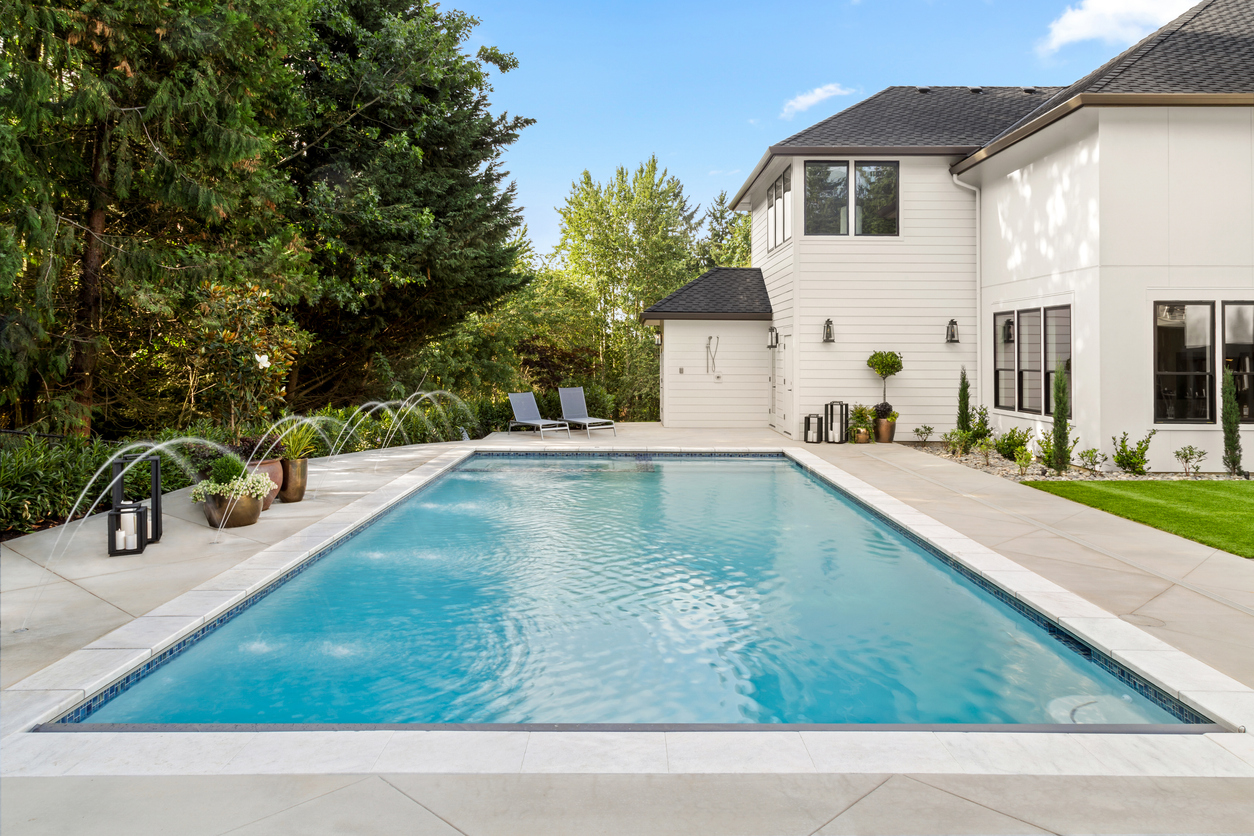swimming pool in backyard exterior of extraordinary luxury home