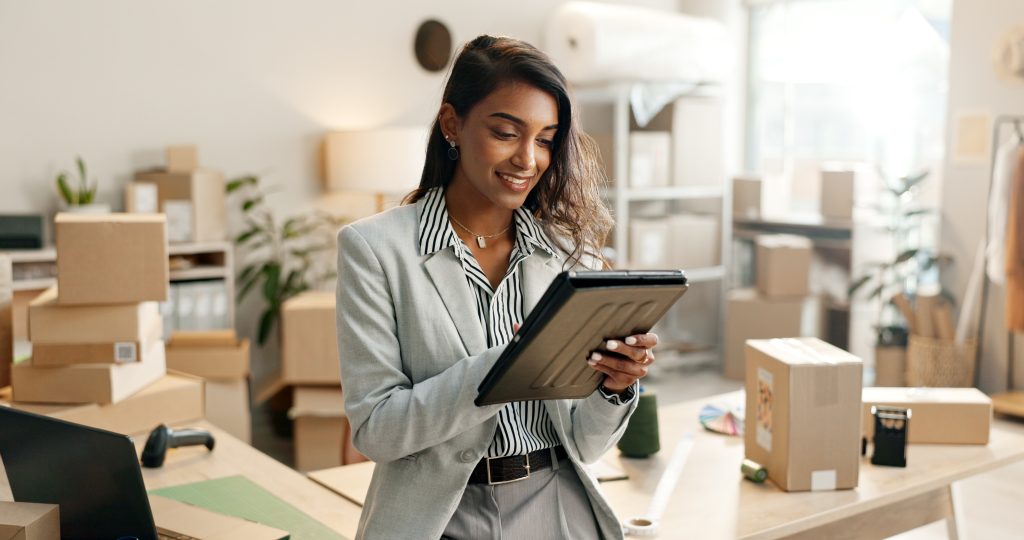 small business, woman and tablet for e commerce, startup and inventory management of online shop, order or courier. entrepreneur or indian seller on digital technology for logistics, boxes or package