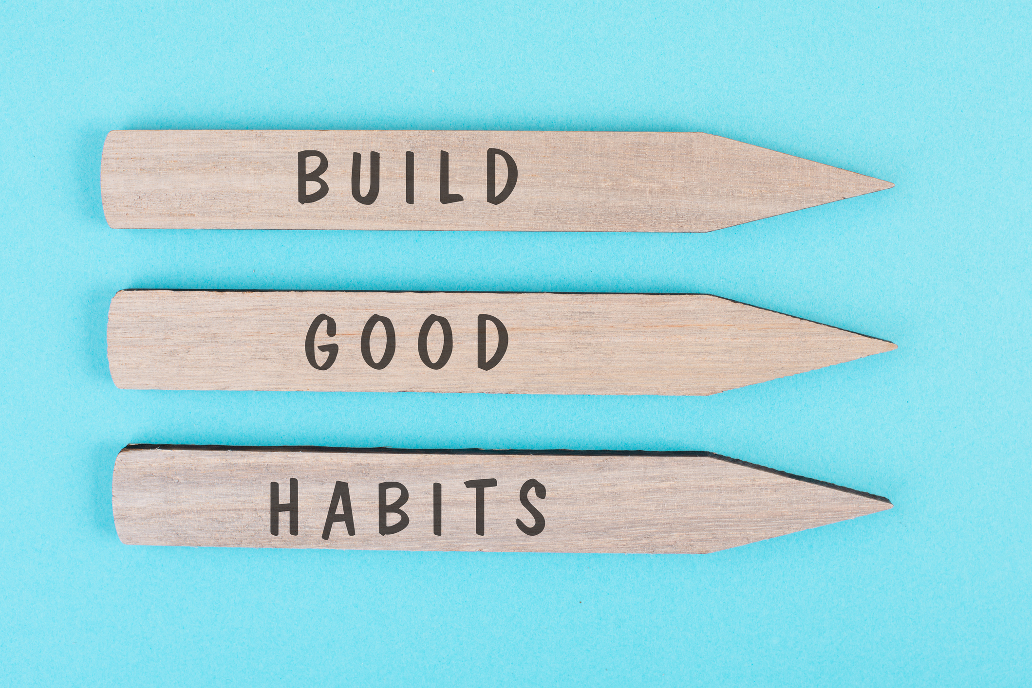 the words build good habits are standing on arrows, change lifestyle, healthy and positive attidude, motivation concept