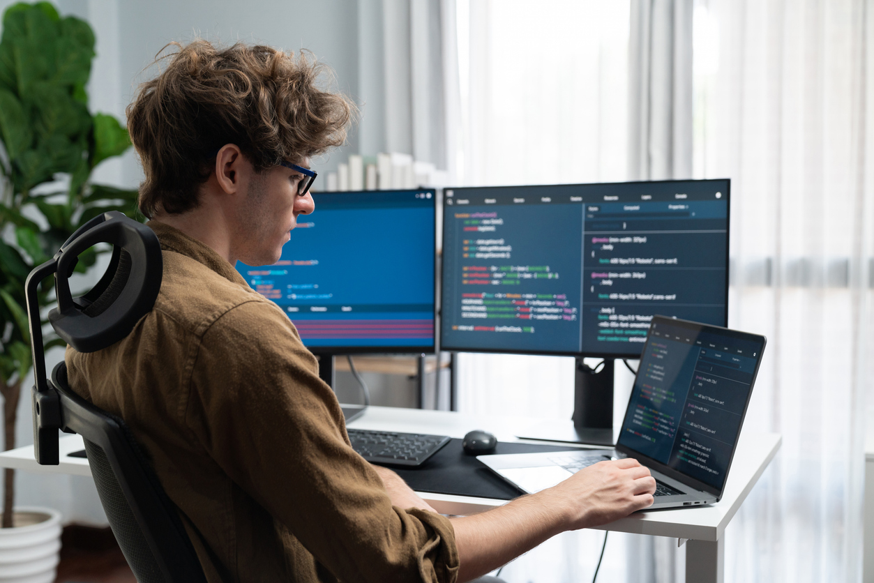 it developer with stressful overworked in creating online software code. gusher.