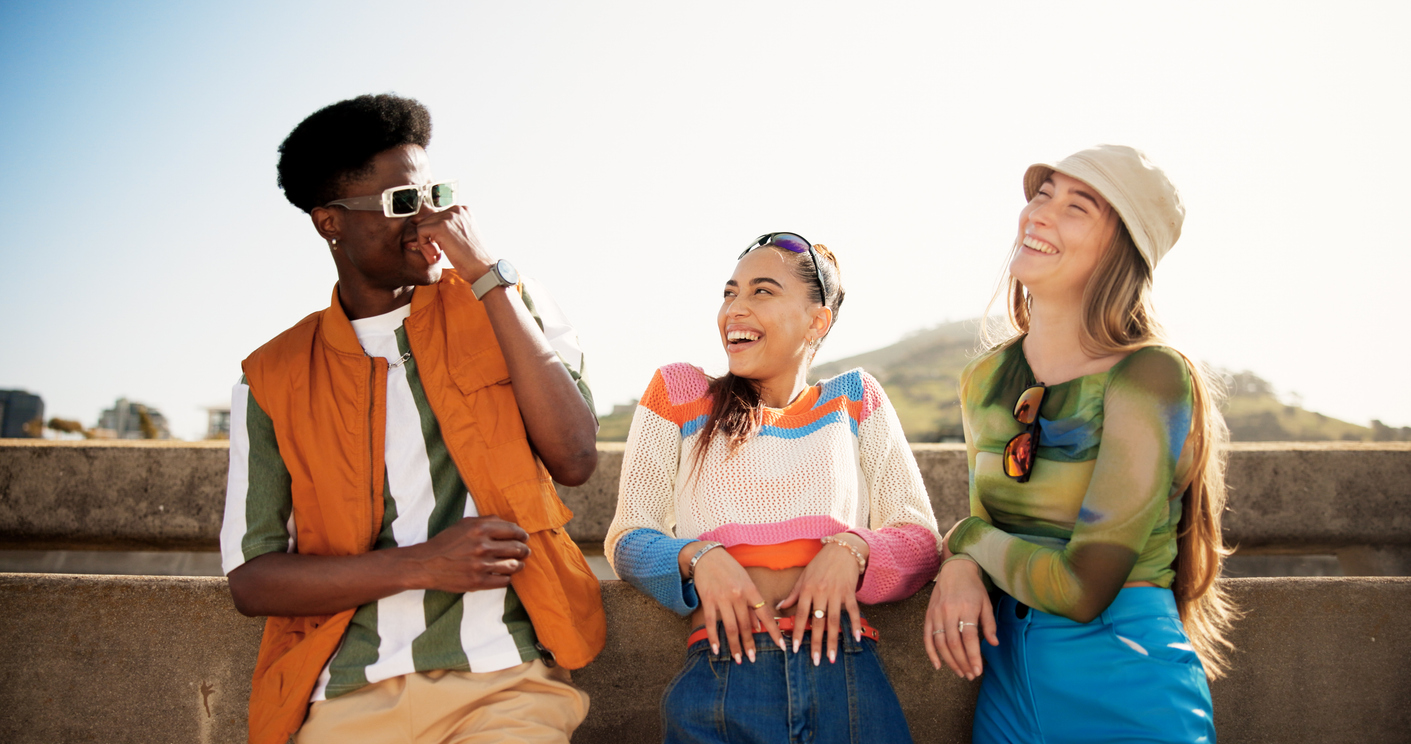 city, funny and friends with laughing for fashion, streetwear and bonding together with gen z style. diversity, man and women on bridge for summer clothes, sunglasses and happy with reunion outdoor