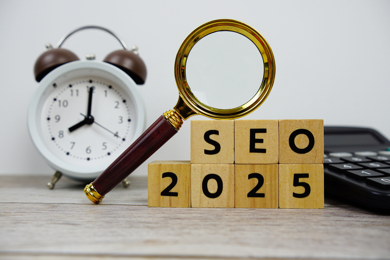 seo 2025 with wooden blocks alphabet letters and magnifying glass on wooden background