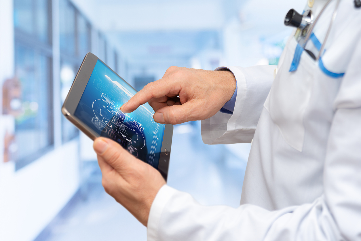 doctor interacts with digital tablet in modern medical facility showcasing advanced technology and patient care