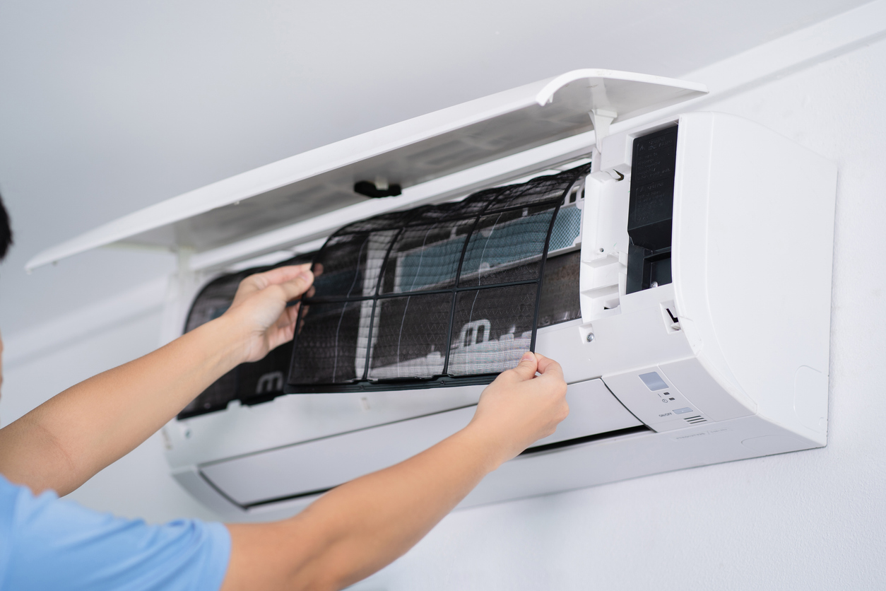 man hand hold air conditioner filter cleaning concept.