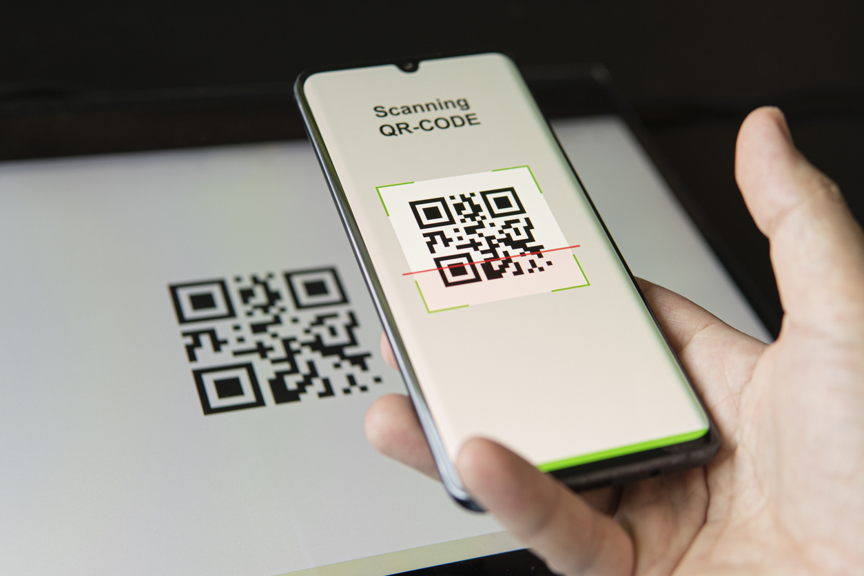 scanning qr code with mobile smart phone. all graphics on the screen are made up. checking the qr code on the mobile phone.