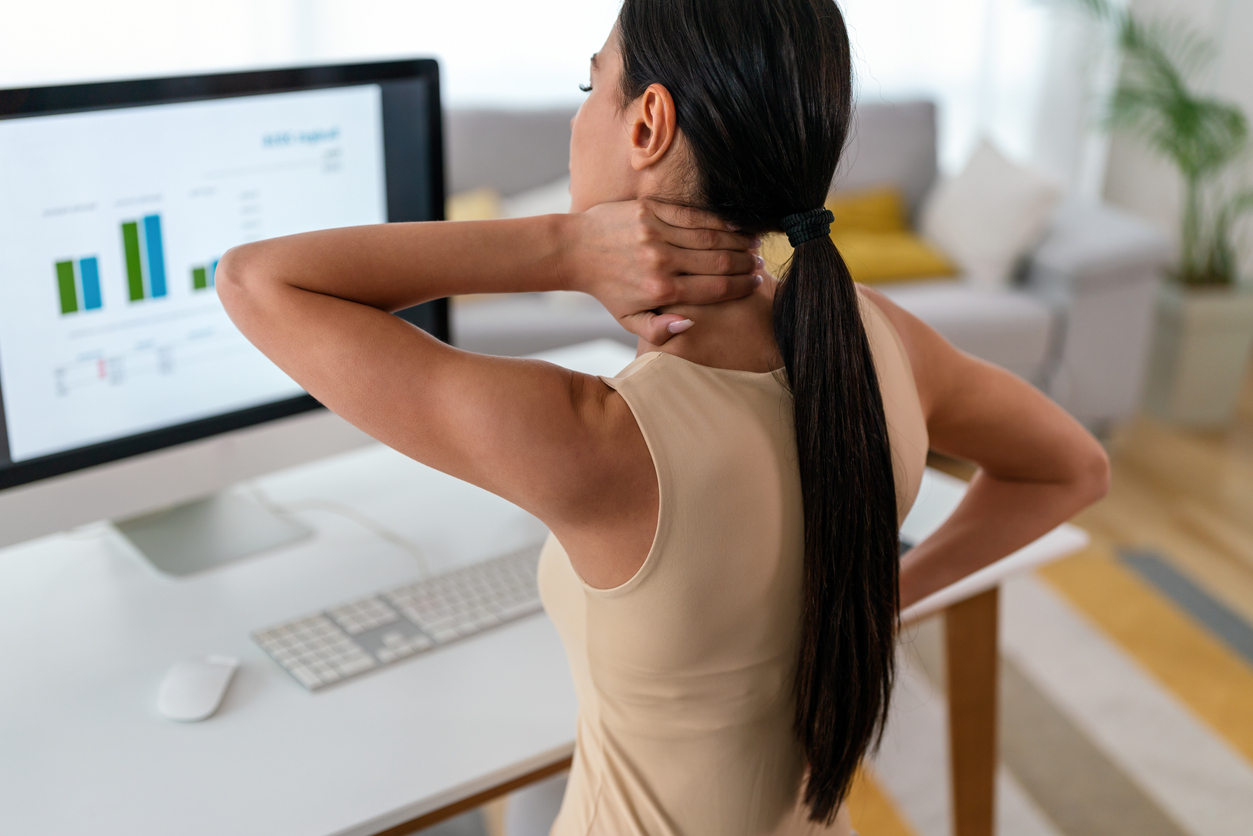 tired woman massaging rubbing stiff sore neck tensed muscles fatigued from computer work
