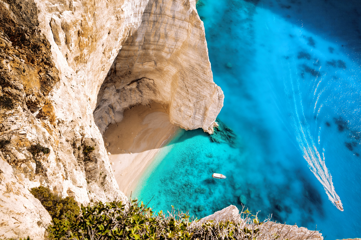 white luxury yacht against azure sea