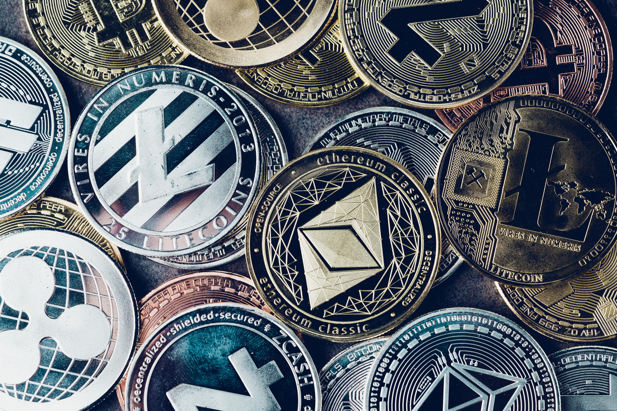 crypto currency background with various of shiny silver and golden physical cryptocurrencies symbol coins, bitcoin, ethereum, litecoin, zcash, ripple