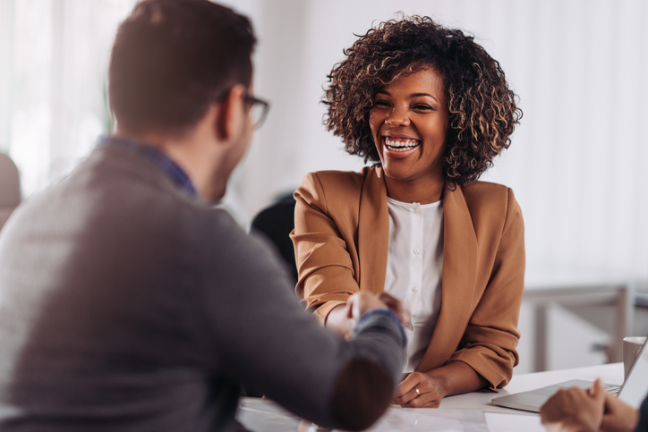 business people shaking hands after meeting