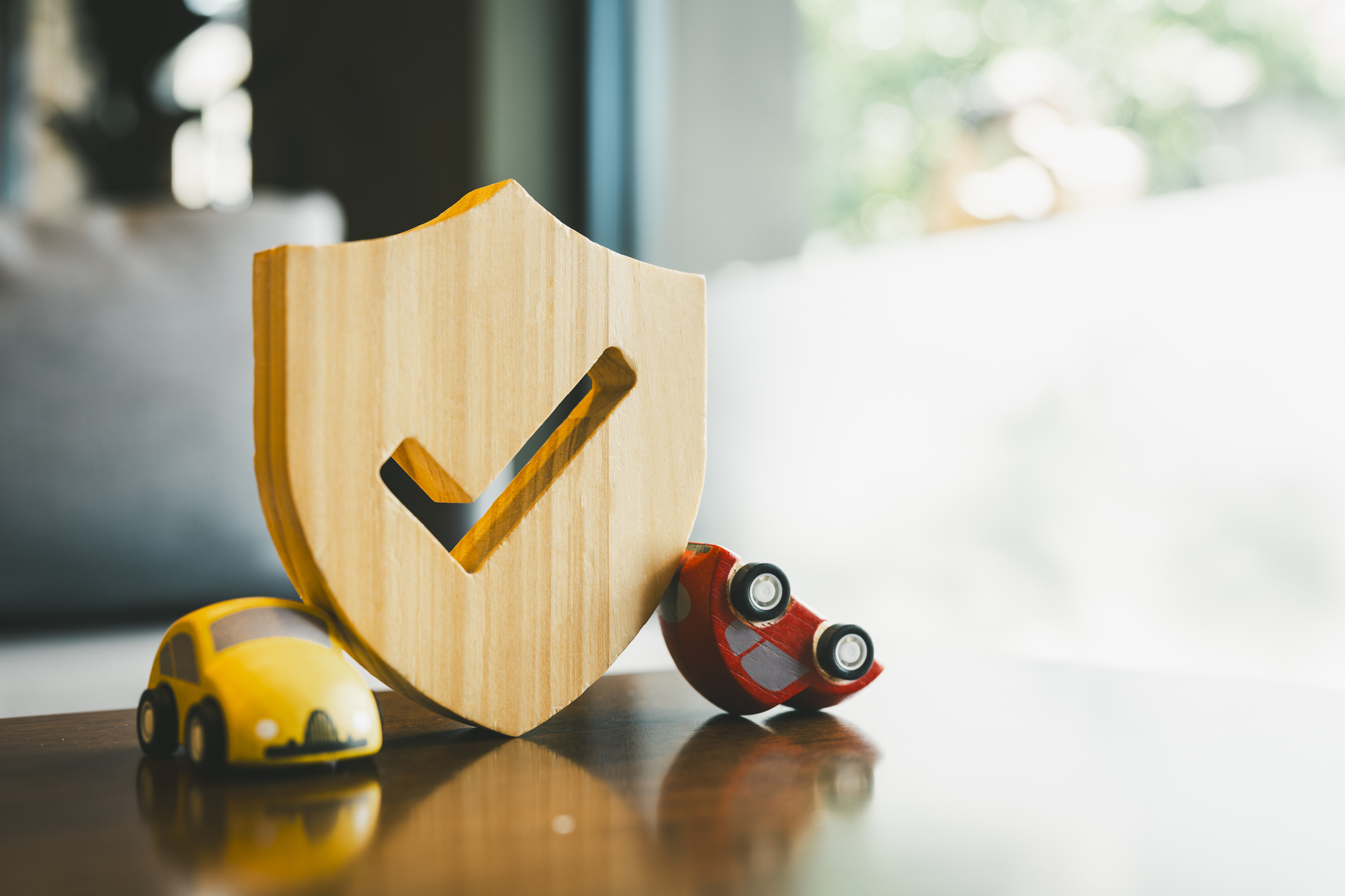 an overturned car that was hit with shield icon, concepts of a symbol for car insurance, vehicle car auto repair service maintenance.