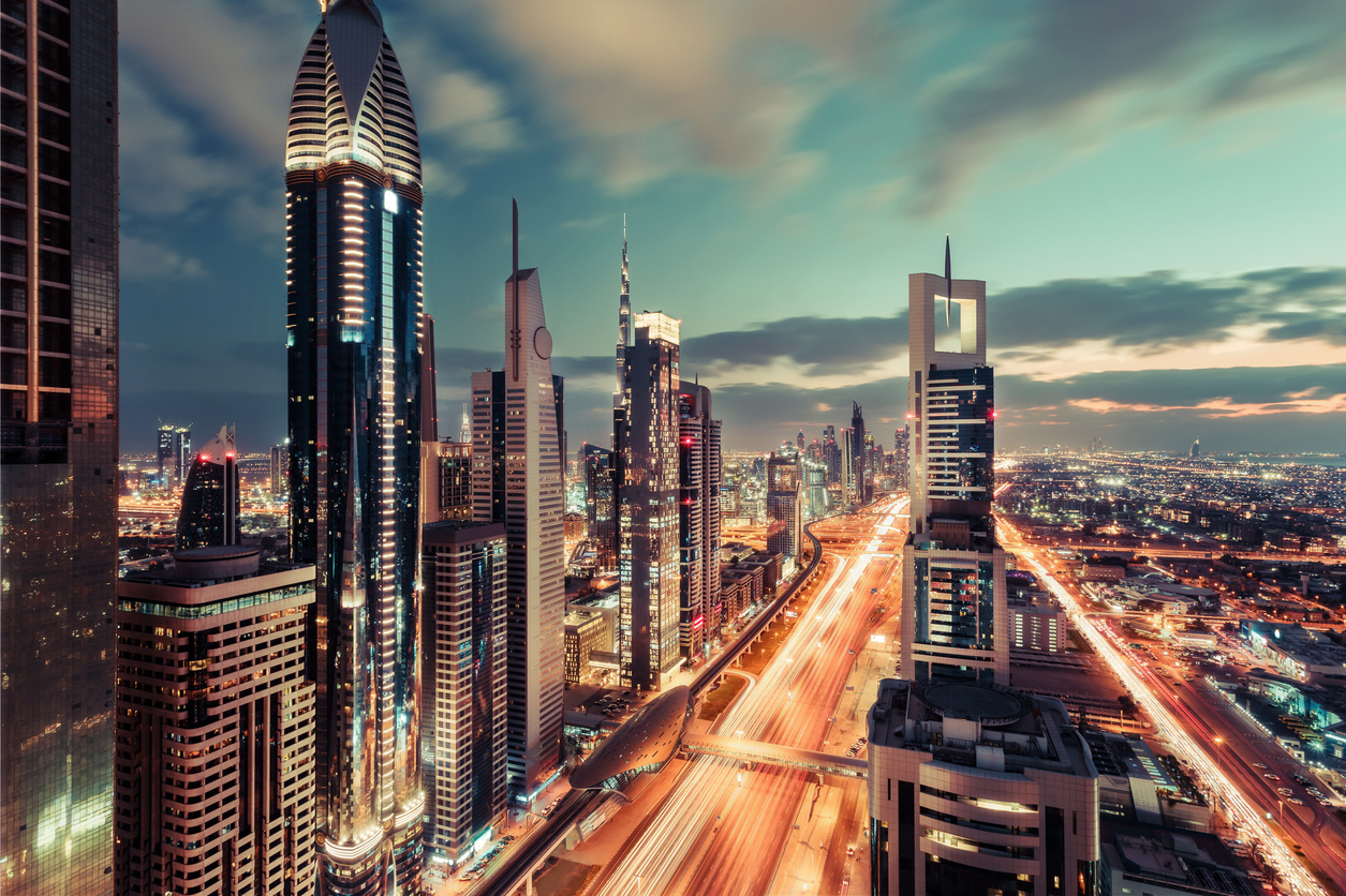 scenic downtown dubai skyscrapers at night with illuminated road.