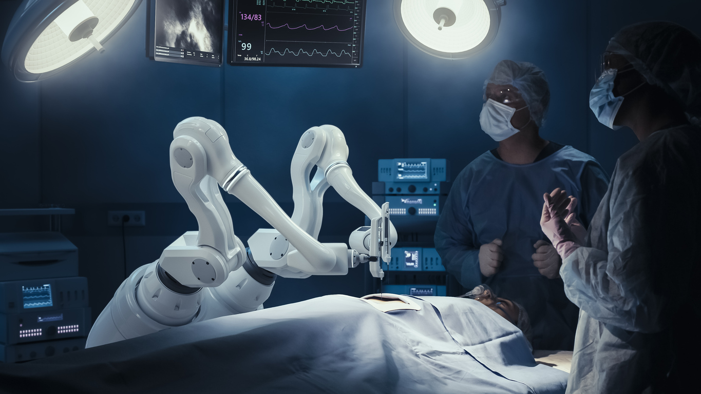 two surgeons observing high precision programmable automated robot arms operating patient in high tech hospital. robotic limbs performing complicated nanosurgery, doctors looking at vitals on monitor.