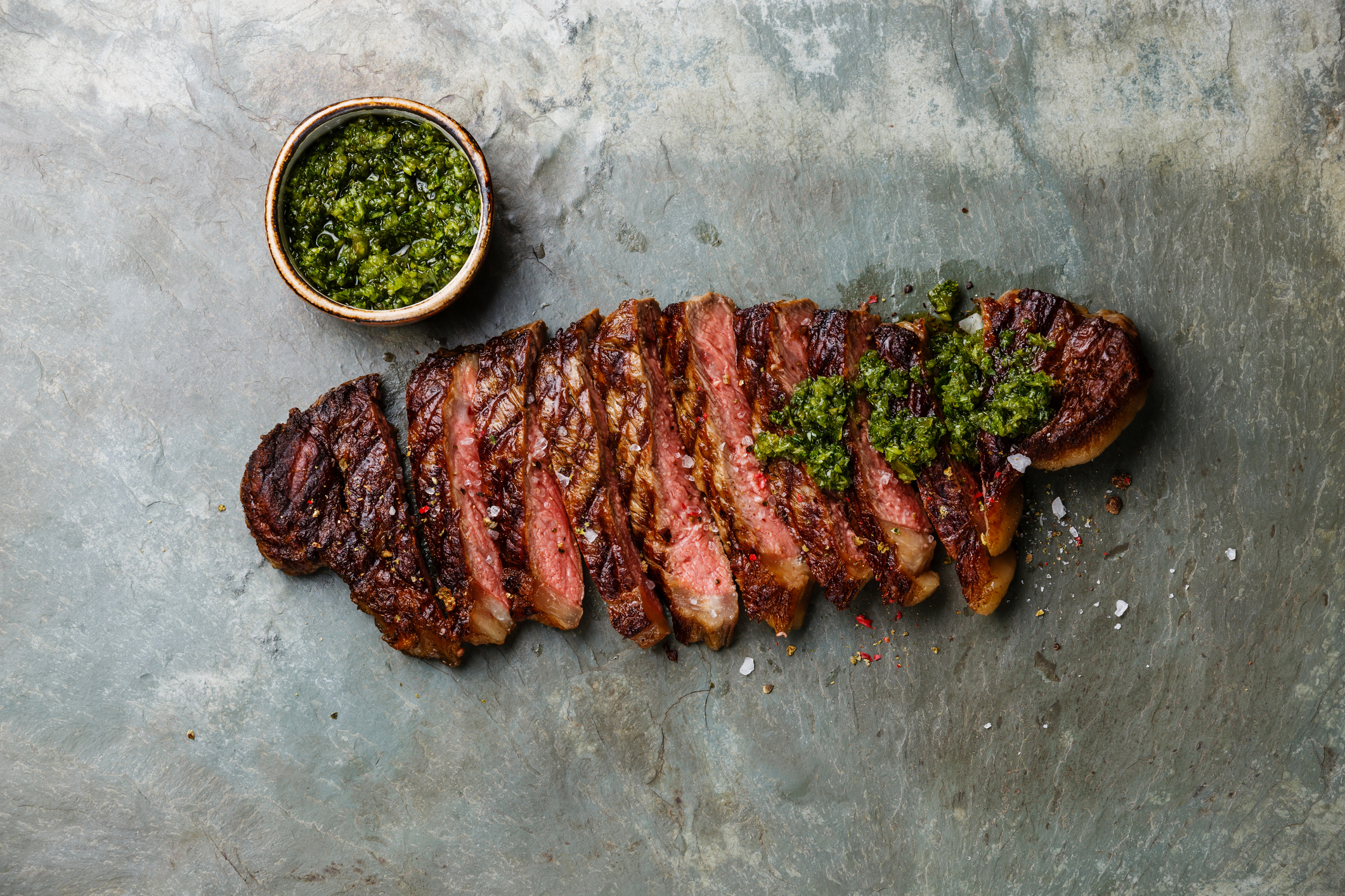 sliced steak with chimichurri sauce