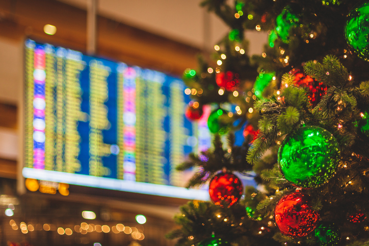 airport scene decorated christmas tree with a flight departures display