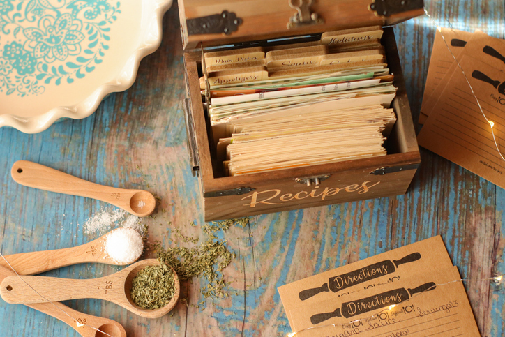 vintage wooden recipe box trunk with natural recipe cards in rustic kitchen