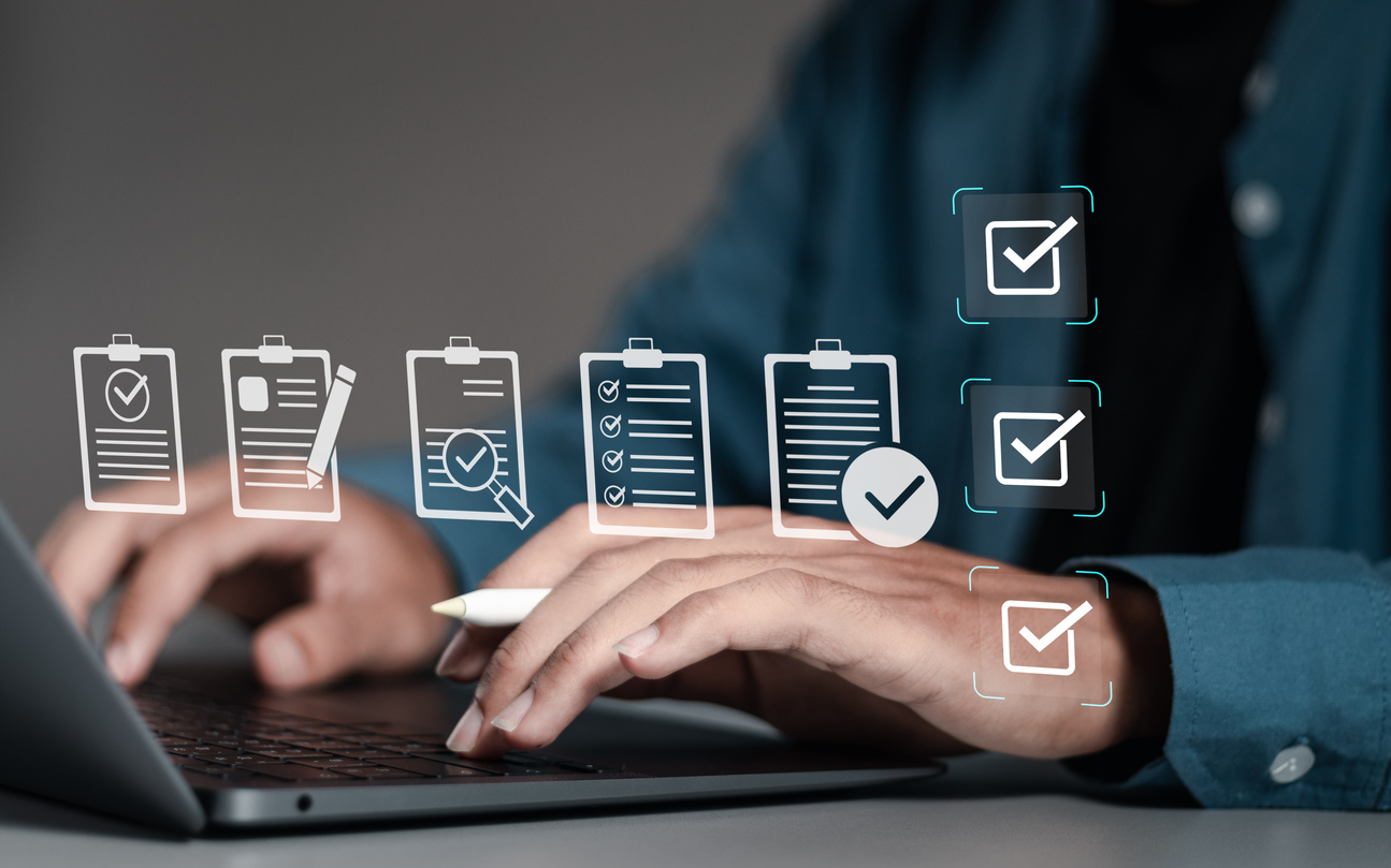 businessman using laptop with document online for approve quality assurance and erp management, quality management with assurance, quality control and improvement.