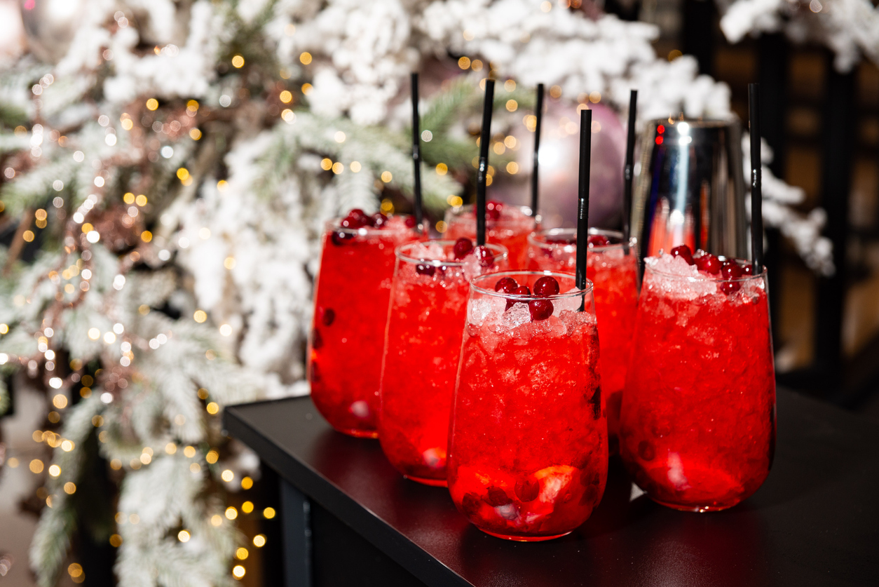festive red cocktails with cranberries and ice.
