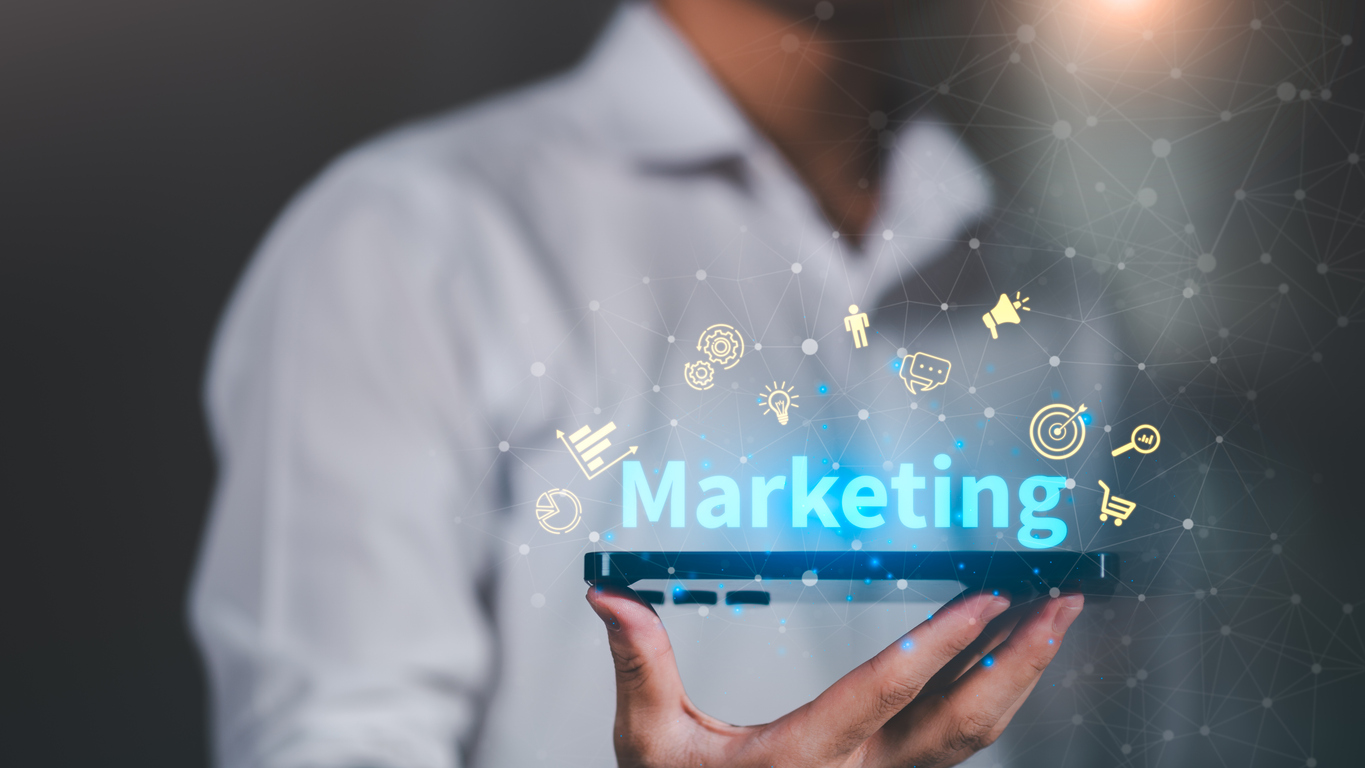 digital marketing strategy concept with holographic icons above smartphone, representing online advertising, sales growth, brand promotion, and customer engagement in modern business.