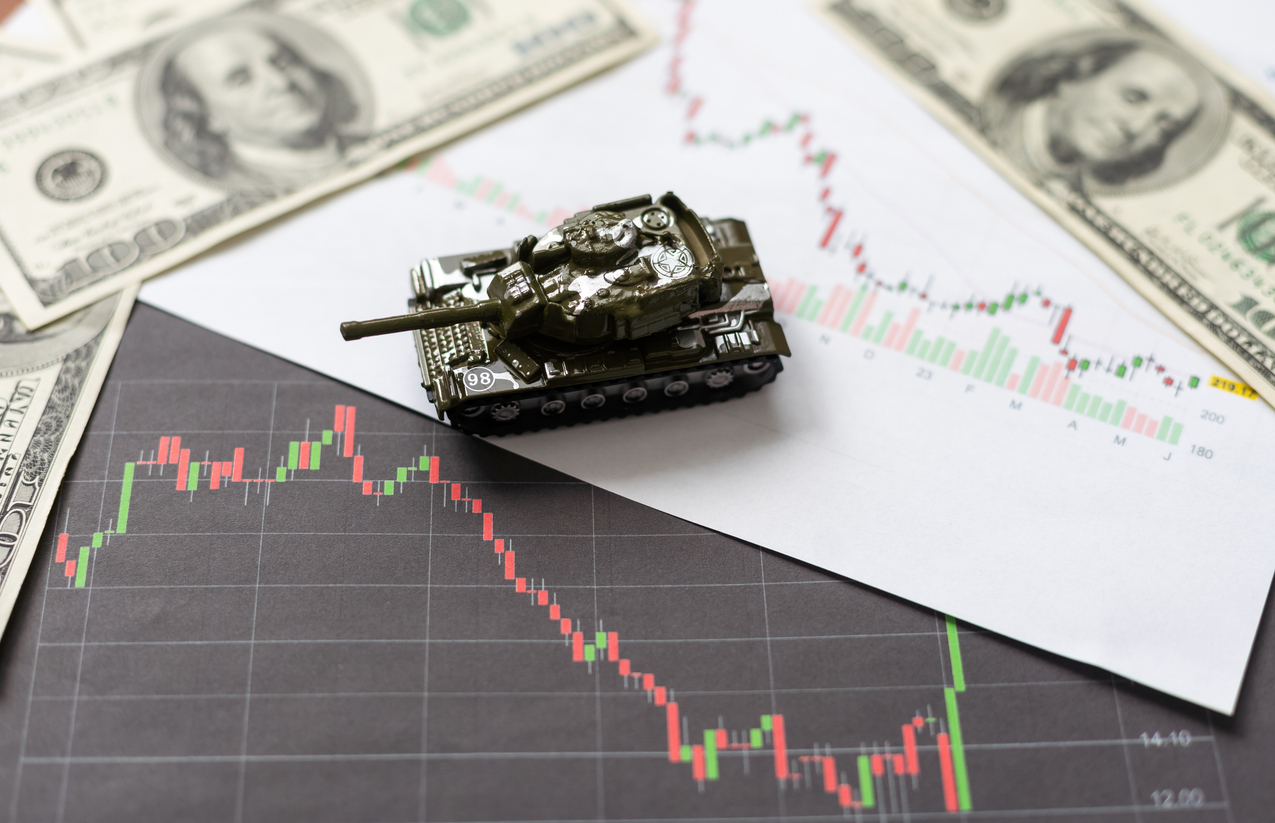 businessman on a tanks with confidence and diagrams rising stock