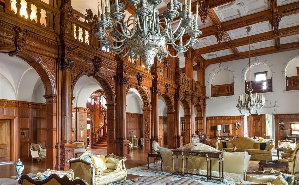 Interior of the Crocker-McMillin Mansion in Mahwah, New Jersey, featuring ornate woodwork, chandeliers, and grand reception rooms.