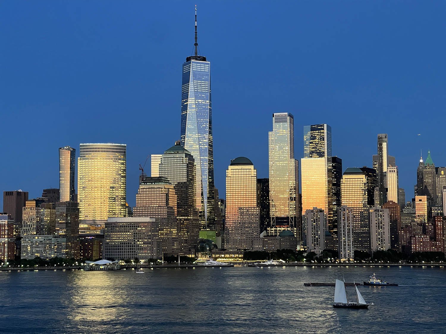 Global financial district skyline at night with illuminated skyscrapers symbolizing modern economic power