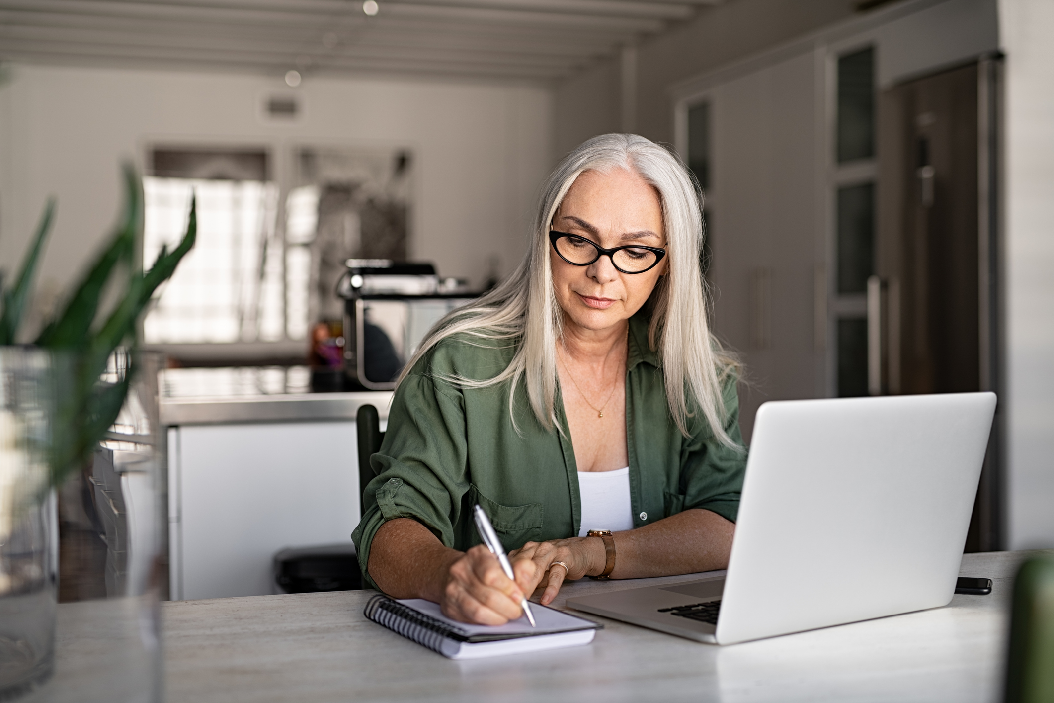 senior fashionable woman working at home